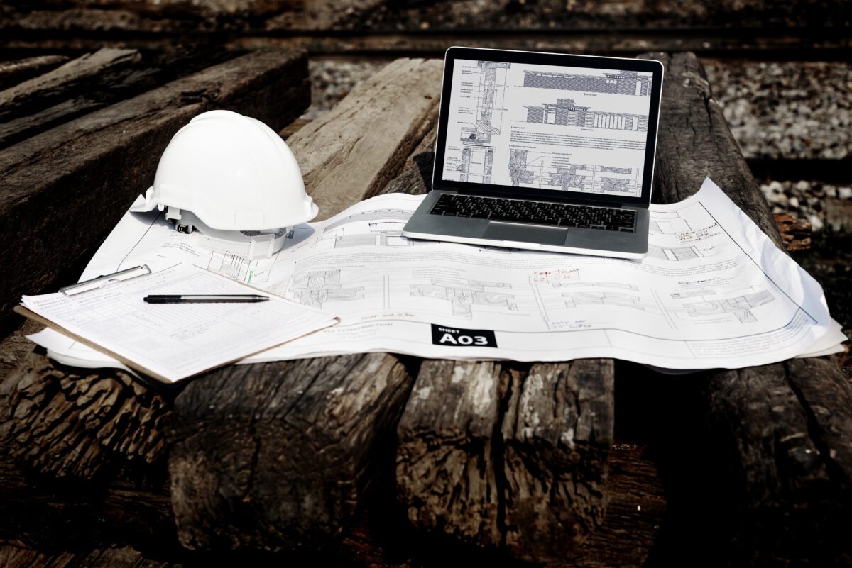 Construction site with plans and employee details