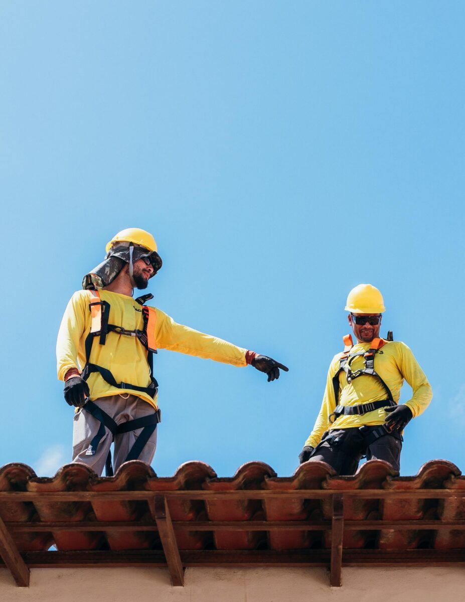 Industrial contractors working hard on a roof